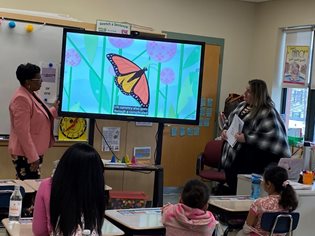 Bank employee KathyAnn Dottin and Jessica Chaves lead a financial literacy session at the Keverian School in Everett, Mass. 