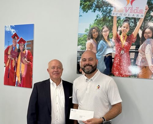 ECSB President and CEO Tim Bombard stands with La Vida Scholars Executive Director Peter Barros