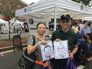 Customers at ECSB's booth during Arlington Town Day.