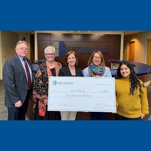 East Cambridge Savings Charitable Foundation check presentation to Chelsea-based nonprofit organization GreenRoots. Standing left to right: Gerry McCue, GreenRoots Board Treasurer; Patricia McGovern, East Cambridge Savings Bank Community Relations Specialist; Gilda Nogueira, East Cambridge Savings Bank Presidnet & CEO and President of the Bank's Charitable Foundation; Roseann Bongiovanni, GreenRoots Executive Director; Priyanka Rangadass, GreenRoots Development Coordinator.